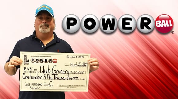 Man in a blue cap holds a Powerball check for $150,000 in front of a red Powerball background