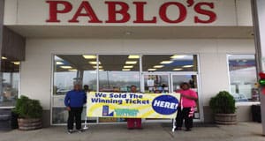 Two people stand in front of Pablo