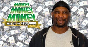 Man smiles in front of a background covered in faded white dollar bills beside the Money Money Money logo