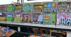 Image of a rack of scratch off game ticket options on a retail counter